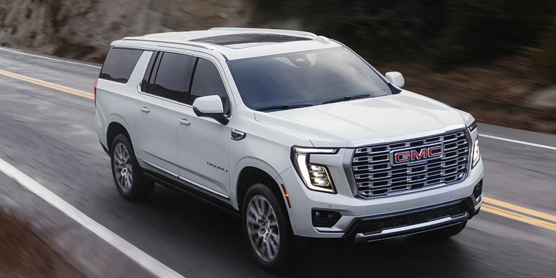 White 2026 GMC Yukon on a mountain highway
