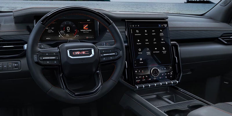 2026 GMC Acadia dashboard with infotainment display.